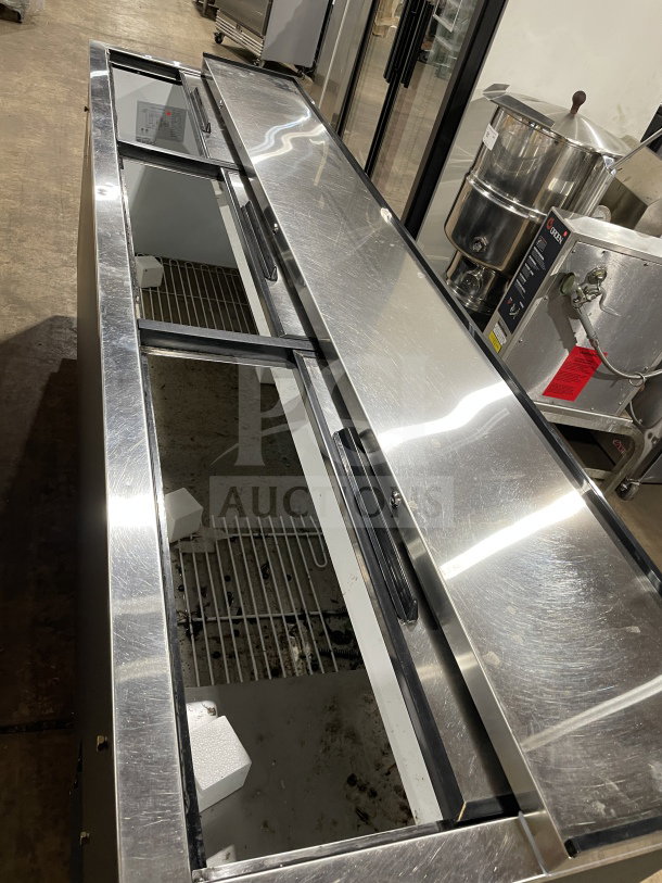Avantco 95" commercial cooler, model 178JBC95B, with heavy-duty sliding doors, black exterior. 115V, on casters, ideal for bars.