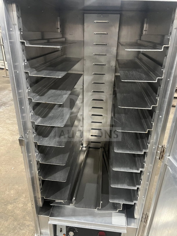 Cres Cor stainless steel heated holding cabinet, model 1290006, with built-in pan slides. Insulated, on casters.
