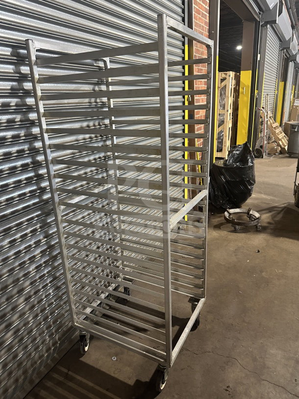 Commercial stainless steel heavy-duty sheet pan rack with casters, 20-tier. Excellent condition, ideal for bakery use.