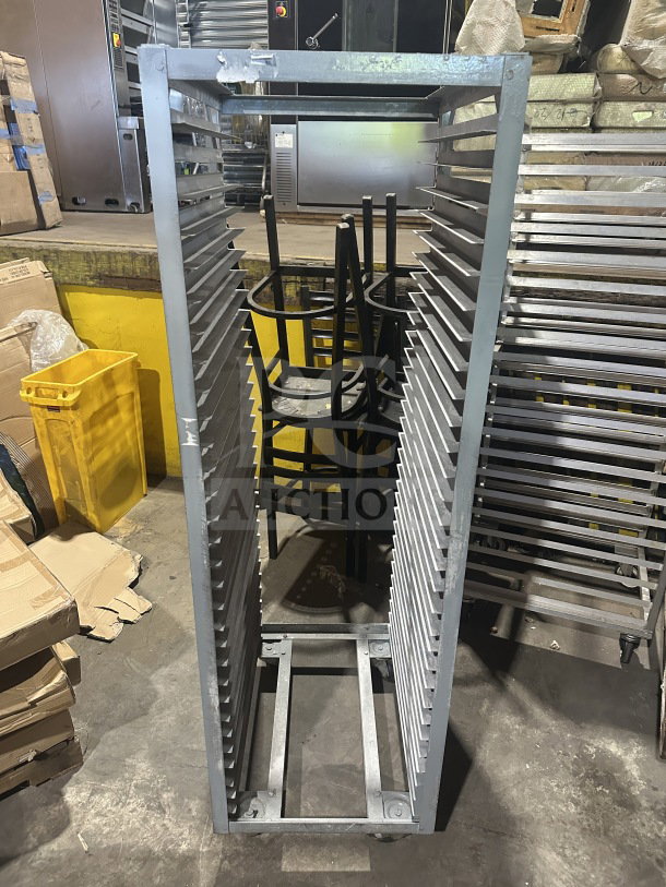 Commercial heavy-duty stainless steel sheet pan rack, featuring multiple shelves and mounted on casters for mobility.