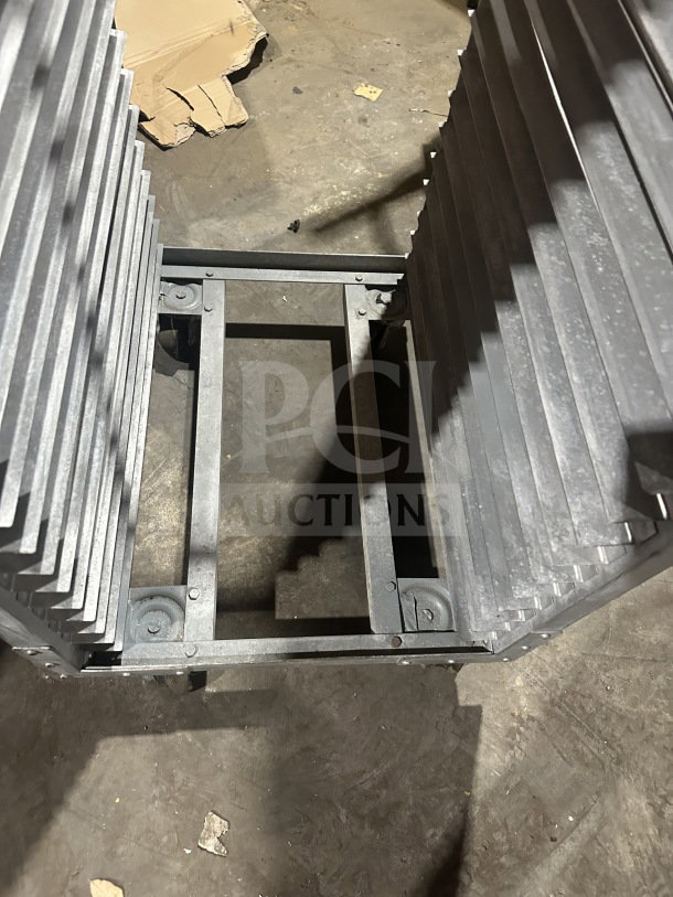 Commercial stainless steel heavy-duty sheet pan rack on casters, sturdy construction, used condition.