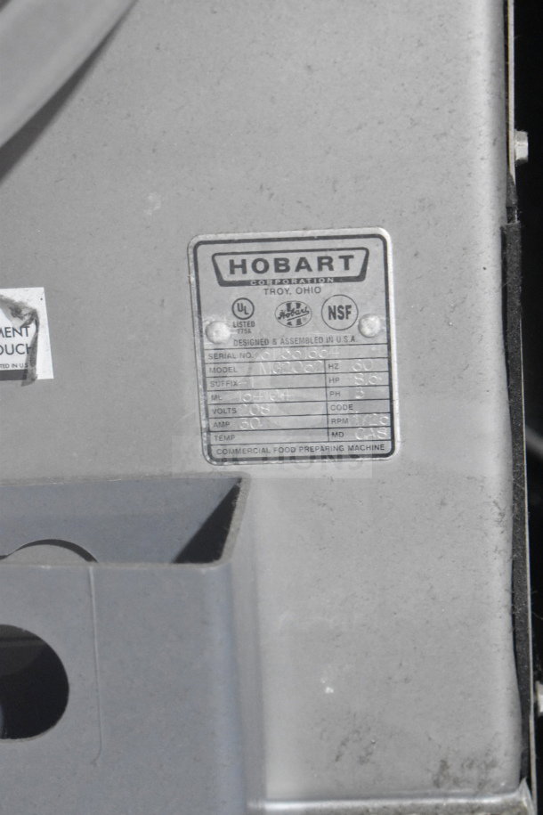 2016 Hobart MG2032 commercial meat mixer grinder, 208V, 3-phase, visible label detailing model and specifications.