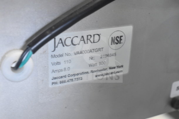 Jaccard VA4000ATGRT meat slicer tag showing model, volts 110, amps 8.0, watt 900; NSF certified.