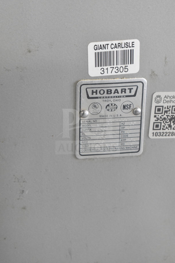 Hobart M-802 commercial mixer label showing model, voltage, serial number, and NSF certification. Includes barcode sticker.