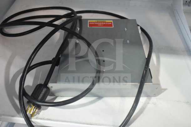 Electrical component for the True TRM3M-YY-BLK-WHT-1BLKLLL-4 merchandiser, featuring a "Refrigerator Only" warning label.