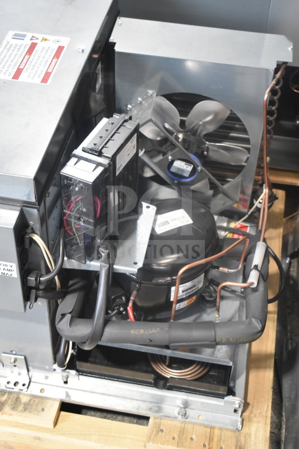 Interior view of a True 2026 commercial black refrigerated merchandiser, model TRM3M-YY-BLK-WHT-1BLKLLL-4, showing cooling components and wiring.