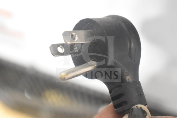 Close-up of a power plug for the 2025 True TSCI-600R-G-PH commercial cooler, 115 volts, 1 phase.