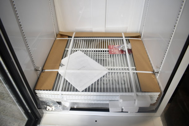Brand new True TSCI-600R-G-PH single door cooler. Includes shelves, manual, and is in excellent condition. 115 Volts, 1 Phase.