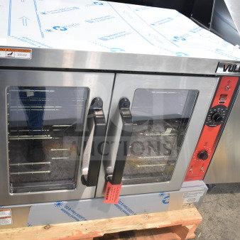 Brand new Vulcan VC4GD-11D150K commercial convection oven with view-through doors, thermostatic controls, minor scratches.