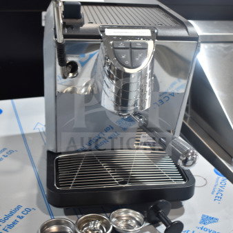 Brand new Nuova Simonelli OSCAR II AD espresso machine, countertop model. Includes portafilter baskets and tamper. 110-120 Volts.