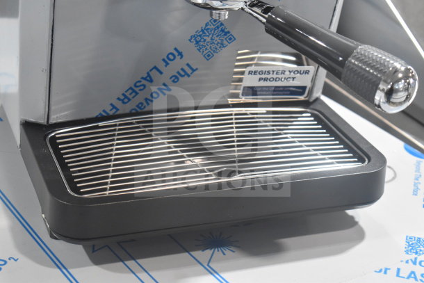 BRAND NEW 2025 Nuova Simonelli OSCAR II AD Espresso Machine. Scratch and dent condition. Includes drip tray and label indicating product registration info.