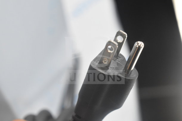 Close-up of the plug from a 2025 Nuova Simonelli OSCAR II AD espresso machine, showing a 110-120 volt, 1 phase cord.