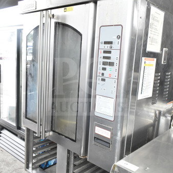 Baxter OV310G commercial natural gas mini rotating rack oven, 95,000 BTU, on double pan rack with casters.