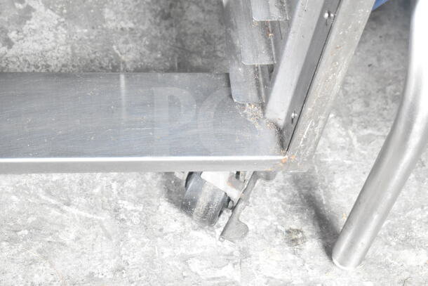 Baxter OV310G rotating rack oven base with double pan rack and commercial casters on concrete floor.