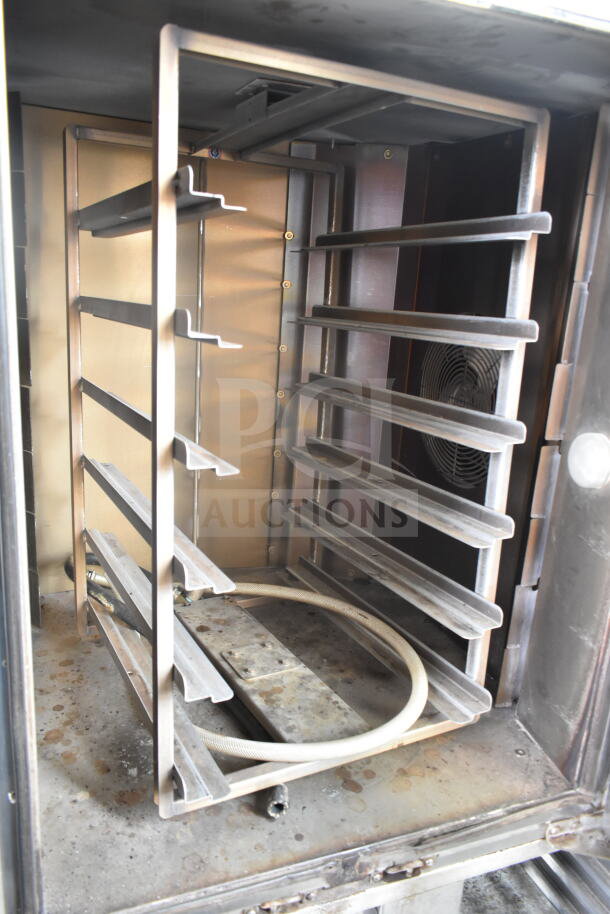 Baxter OV310G commercial gas mini rotating rack oven, 95,000 BTU, with double pan rack and commercial casters, interior view.