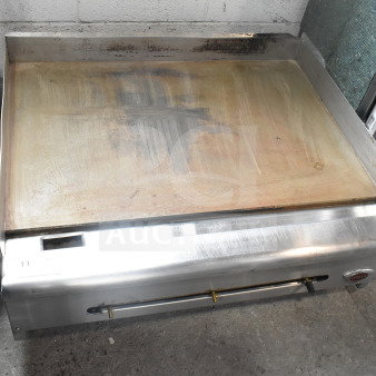 Wells Commercial Gas Flat Top Griddle, countertop model, well-used condition, stainless steel body, visible grime on cooking surface.