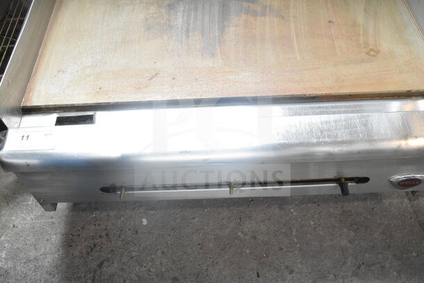 Wells Commercial Gas Flat Top Griddle, stainless steel, countertop model, used condition, visible Wells logo.