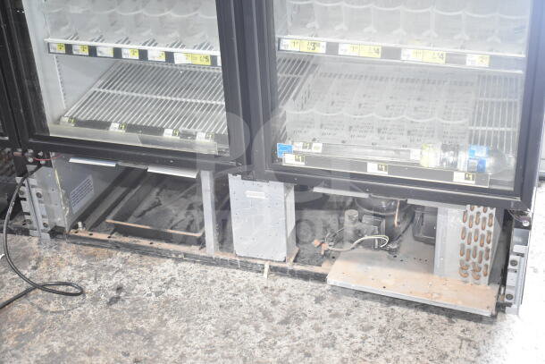 2018 True GDM-49-HC commercial cooler, 2 glass doors, 115 volts, tested working, shelving inside, visible pricing labels.