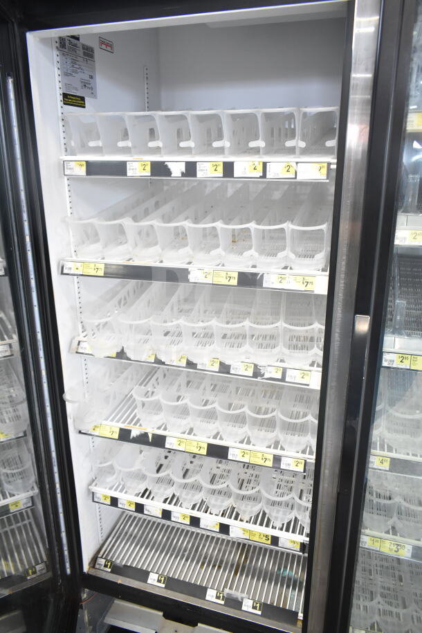 2018 True GDM-49-HC Cooler, 2 glass doors, tested and working, 115 Volts, 1 Phase, shelves intact, label visible.