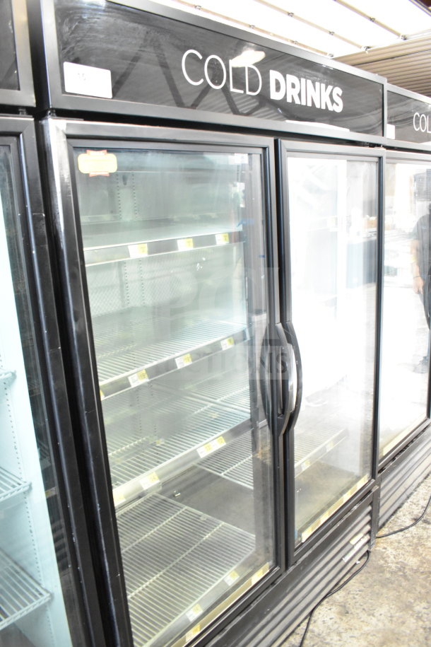 2018 True GDM-49-HC 2-door commercial cooler, tested and working. Features glass doors, multiple shelves, and "Cold Drinks" signage.