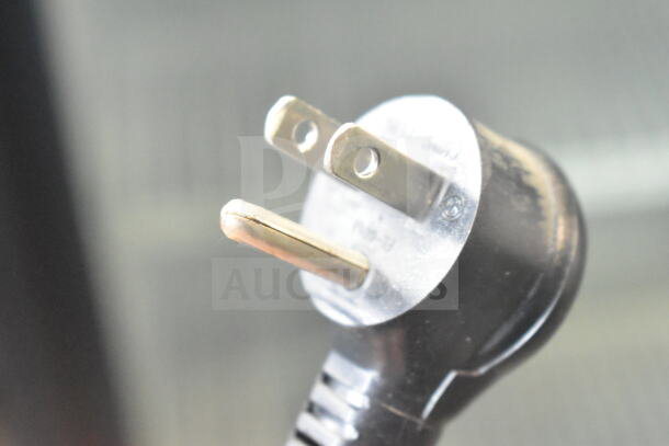 Close-up of a plug from a 2019 True GDM-49-HC cooler. 115 volts, 1 phase, tested and working condition.