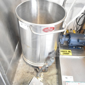 Oscar Fisher stainless steel tank with handles, visible Oscar Fisher logo, in good condition, near waste oil caddy.