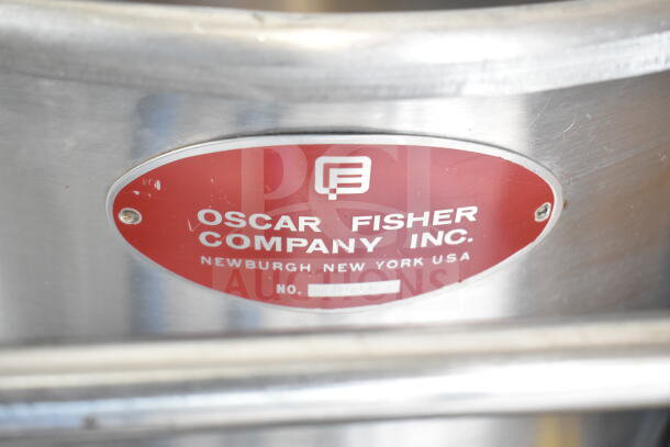 Oscar Fisher Stainless Steel Tank with red label indicating manufacturer, location in Newburgh, NY, and serial number area.