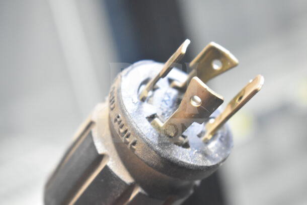 Close-up view of a power plug for the 2018 True GDM-72F-HC freezer. Clear prongs and secure, reliable connection.