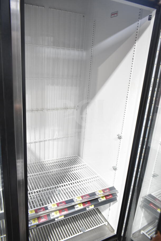 2018 True GDM-72F-HC 3-door reach-in freezer merchandiser, tested and working, with visible shelving and interior tags.
