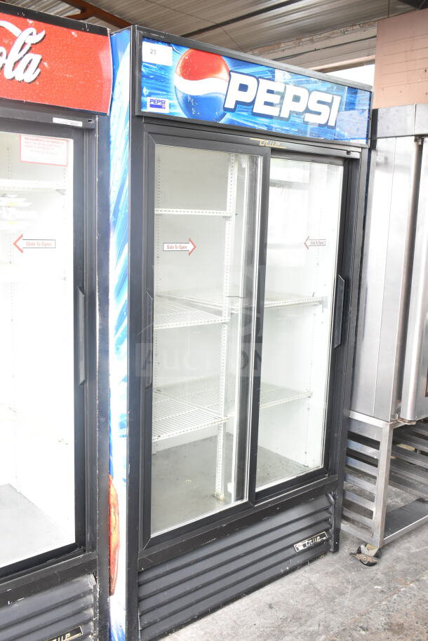 True GDM-37 commercial 2-door cooler, Pepsi branding, glass doors, 115 volts, used condition, model label visible.