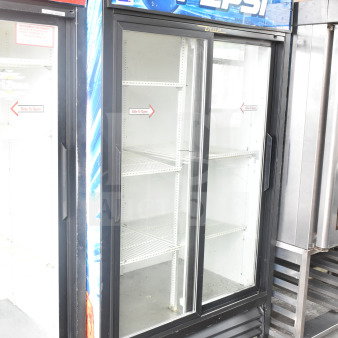 True GDM-37 commercial 2-door cooler, Pepsi branding, glass doors, 115 volts, used condition, model label visible.