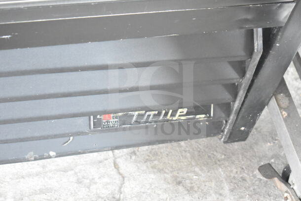 True GDM-37 Commercial 2 Door Cooler, 115 Volts, 1 Phase, True logo visible, black exterior, good condition.