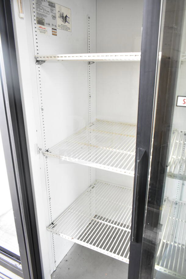 True GDM-37 Commercial 2 Door Reach In Cooler, model GDM-37. Features adjustable shelves and glass doors. 115 Volts, 1 Phase.