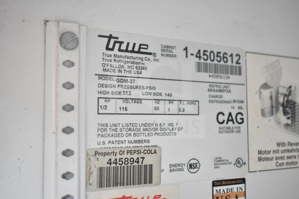 True GDM-37 Commercial Cooler label showing specs: 115 volts, 1 phase, refrigerant R134A, NSF certified, serial 1-4505612.