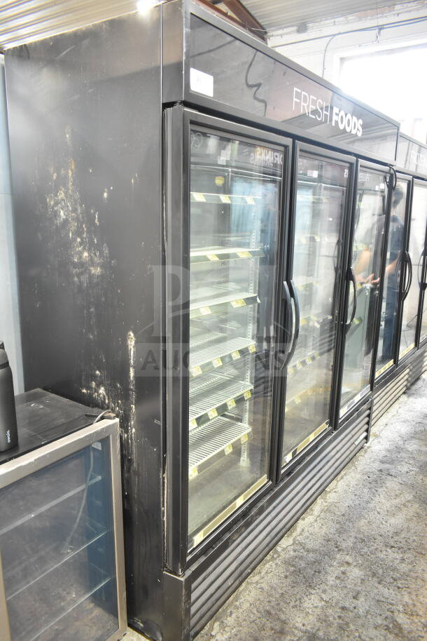 2018 True GDM-72-HC commercial 3-door cooler, black exterior, glass doors, tested and working, signs of wear.