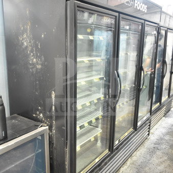 2018 True GDM-72-HC commercial 3-door cooler, black exterior, glass doors, tested and working, signs of wear.