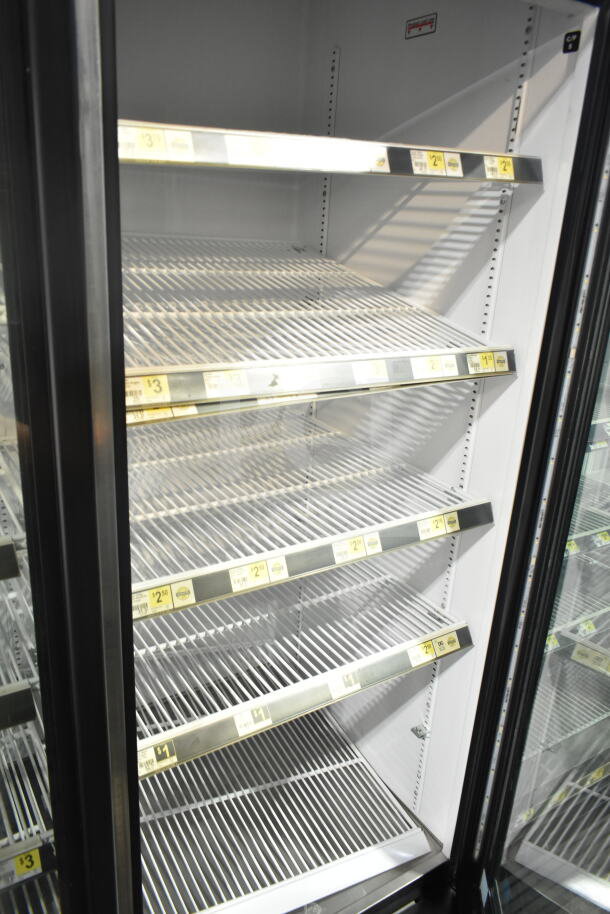 2018 True GDM-72-HC commercial cooler with three glass doors, white interior, wire shelving, tested and working.