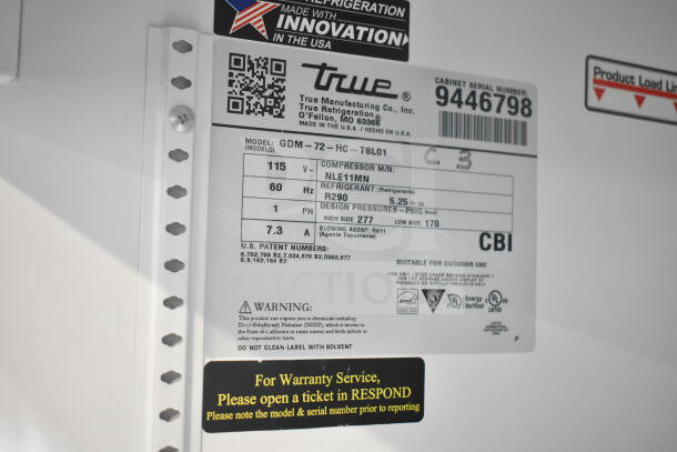 2018 True GDM-72-HC 3 Door Refrigerated Merchandiser label showing model, voltage, and refrigerant details.