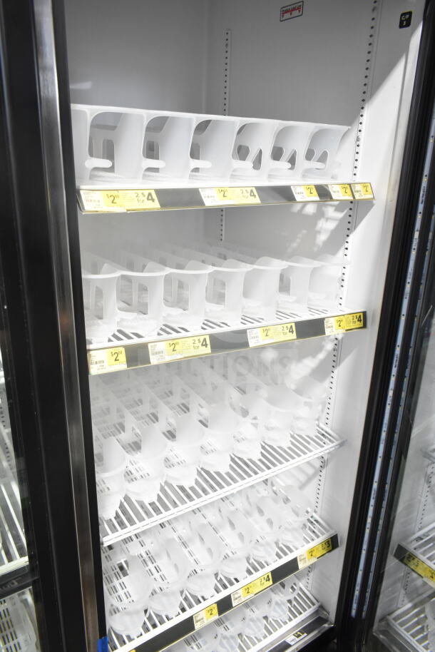 2018 True GDM-72-HC commercial 3-door cooler, tested working, with adjustable shelves and price tags visible inside.