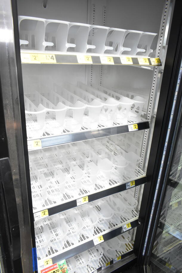 2018 True GDM-72-HC 3-door cooler merchandiser, tested, working, 115V, 1-phase, with shelving and pricing tags visible.
