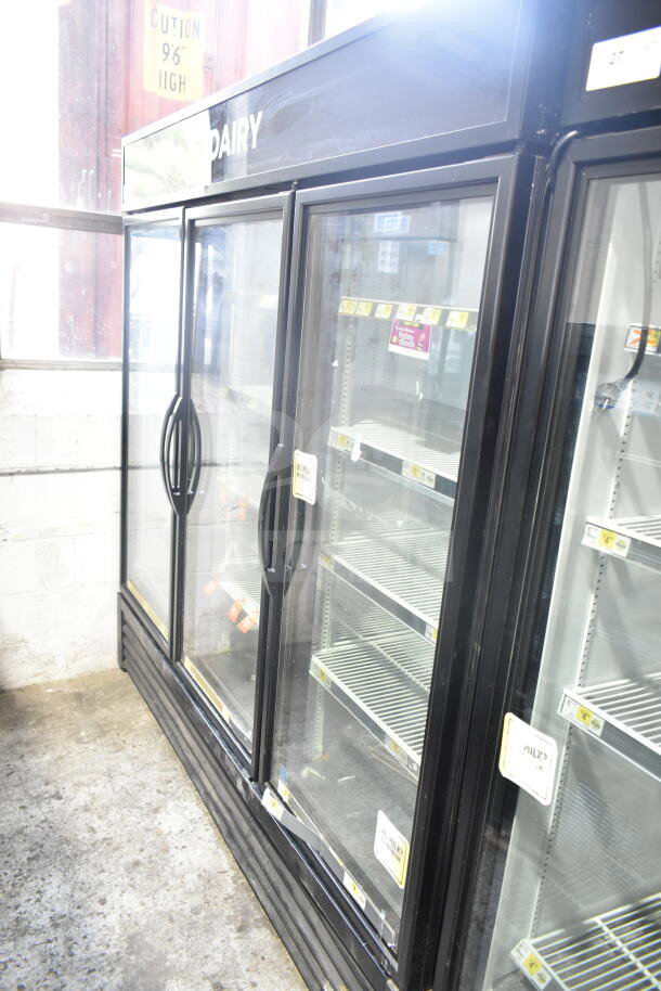 2018 True GDM-72-HC commercial 3-door reach-in cooler merchandiser, tested and working, 115 volts, 1 phase, black exterior.