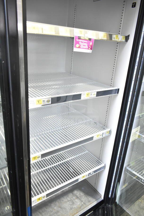 2018 True GDM-72-HC 3 Door Reach-In Cooler Merchandiser, tested and working, 115 volts, 1 phase, shelves and pricing labels visible.