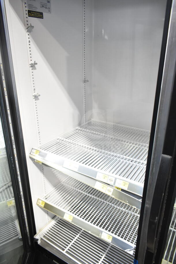 2018 True GDM-72-HC commercial 3-door cooler merchandiser with shelves. Tested and working. 115 volts, 1 phase.