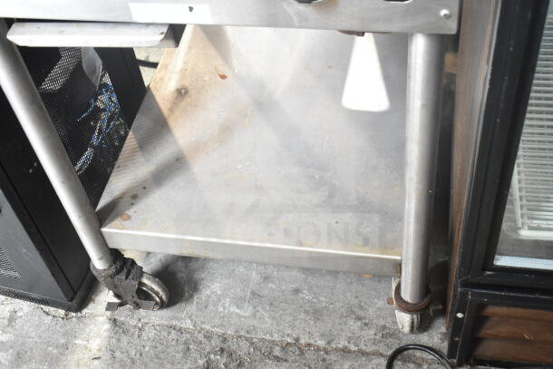 Jade Range commercial countertop gas griddle with under shelf, stainless steel, caster wheels for mobility, used condition.