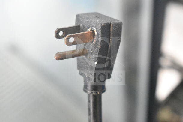 Power plug for True GDM-19 commercial cooler; 115 volts, 1 phase. Three-prong, black cord, in used condition.