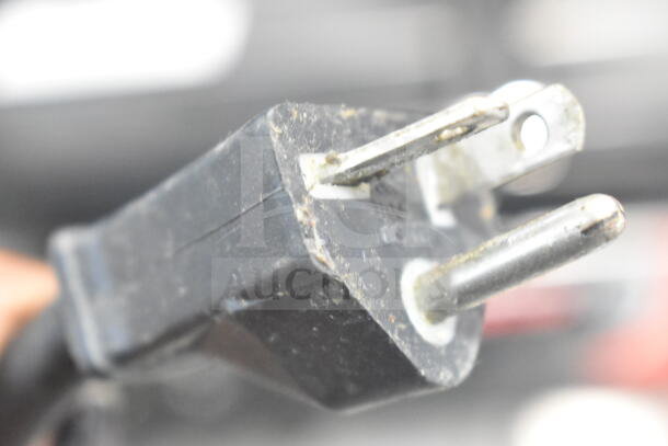 Close-up of plug for Sirman 16G02522 Commercial Panini Press, 230V, 1 Phase, showing standard design with signs of wear.