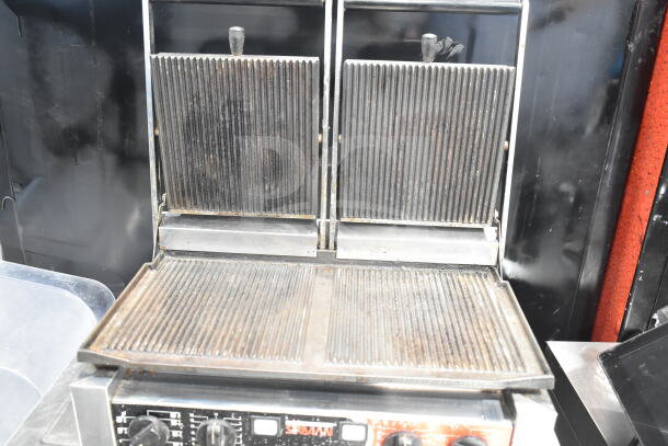 Sirman 16G02522 Commercial Countertop Double Panini Press, features ridged plates, 230 Volts, 1 Phase, good condition.