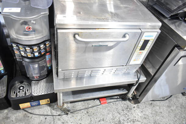 Turbochef NGC countertop rapid cook oven on equipment stand with casters, electric, 120/208-240V, 1 phase, used condition.