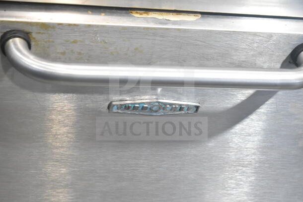 Turbochef NGC commercial rapid cook oven, stainless steel, on stand with casters, scratches and wear visible, 120/208-240V.