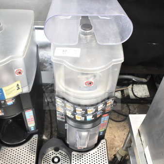 Taylor X83684-12 frozen beverage drink mixing machine, commercial countertop model. Features clear container and control panel.